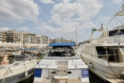 Sunseeker Travado 40 Barracuda docked in marina with city buildings in the background