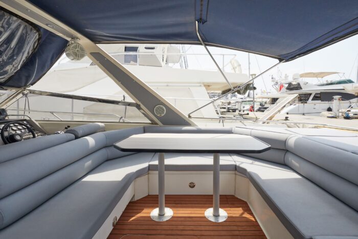 Shaded cockpit lounge area with table on Sunseeker Travado 40 Barracuda motorboat