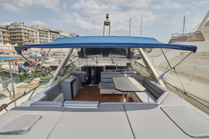 Aft deck of Sunseeker Travado 40 Barracuda with sunbeds, dining area and canopy